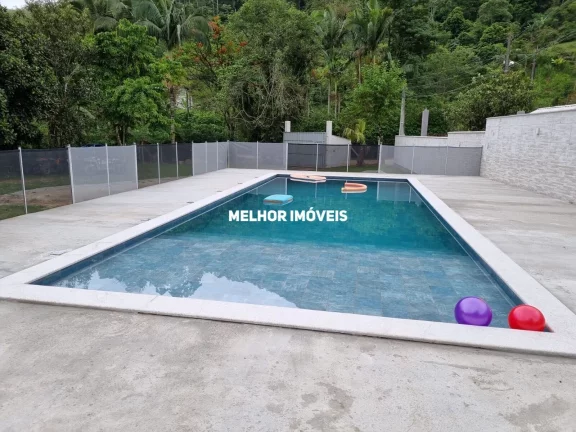 Imagem Chácara á venda com 2 casas, piscina, salão de festa localizada em Camboriú Santa Catarina