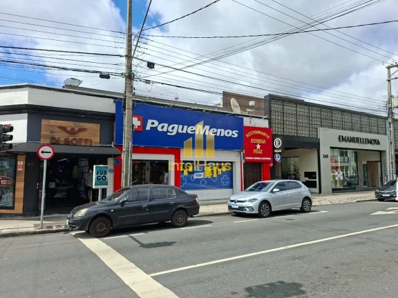 Imagem Imóvel comercial à venda em localização estratégica no Bacacheri, em terreno de esquina com gra...