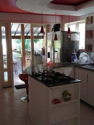 Imagem Casa com 4 quartos (1 suíte) à venda, 390 m²