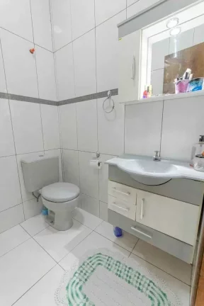 Imagem Casa com 3 suítes e 2 vagas de garagem no Centro de Balneário Camboriú.