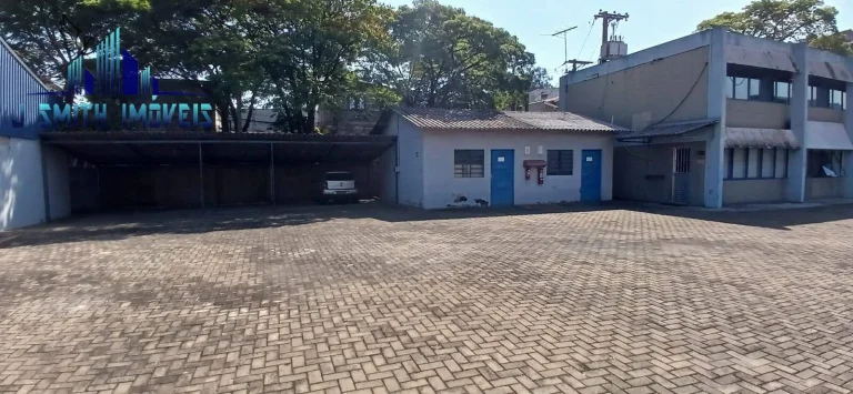 Imagem TERRENO COM GALPÕES Á VENDA - A.T. 7.430m² . AC. 2.816m² (5 galpões+adm)