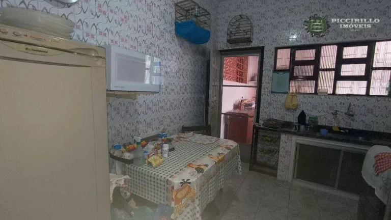 Imagem Casa com 3 dormitórios à venda, 240 m² por R$ 700.000,00 - Caiçara - Praia Grande/SP
