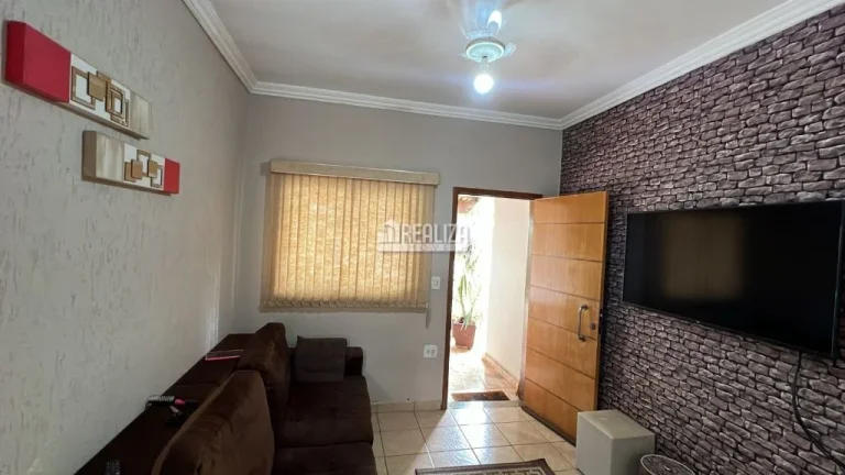Imagem Casa à venda no Fabrício, Uberaba: 3 dormitórios, churrasqueira e móveis planejados.