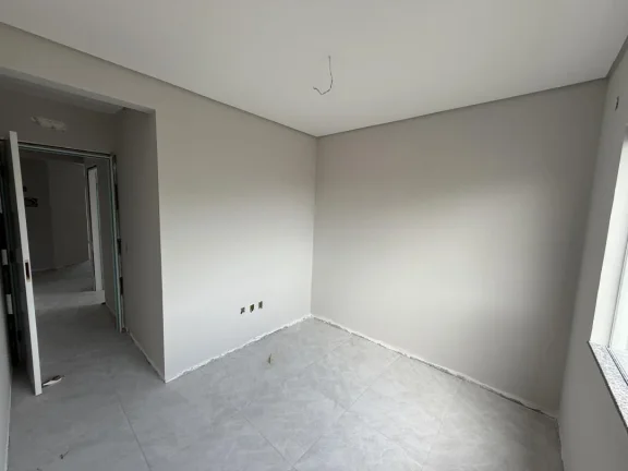 Imagem Apartamento de dois dormitórios, sendo uma suíte, sacada com churrasqueira e uma vaga de garagem no bairro de Gravatá, em Navegantes - Adriano Carpes imóveis vende