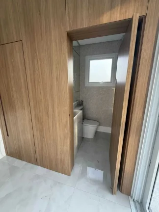 Imagem Casa em condomínio com 4 suítes e 2 vagas de garagem