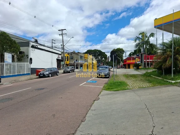 Imagem Imóvel comercial à venda em localização estratégica no Bacacheri, em terreno de esquina com gra...
