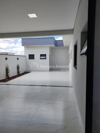 Imagem Esta casa térrea de 166 metros quadrados é uma joia de elegância e conforto. Com três quartos, s...