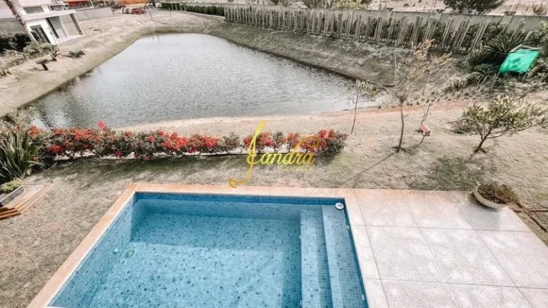 Imagem Casa térrea com 3 suítes e beira de lago com piscina