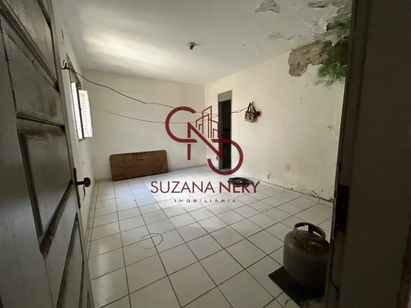 Imagem Prédio comercial com uma casa, 2 lojas e 11 kitinets