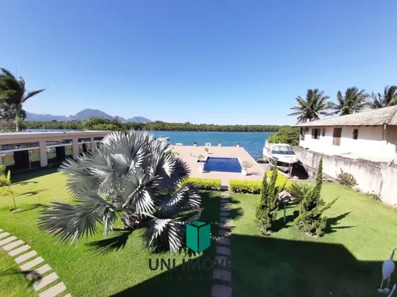 Imagem Mansão de luxo à venda no Canal de Guarapari com marina privativa, 5 suítes e lazer completo