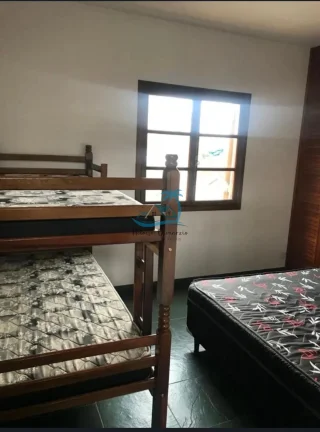 Imagem Sobrado com 4 dormitórios sendo 3 suítes e 1 banheiro social a venda no Itaguá em Ubatuba.