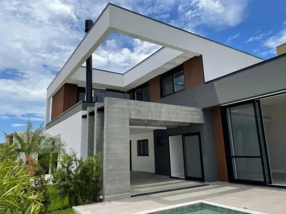 Imagem Casa nova com 4 suítes e 4 vagas privativas de garagem em condomínio fechado em Camboriú/SC