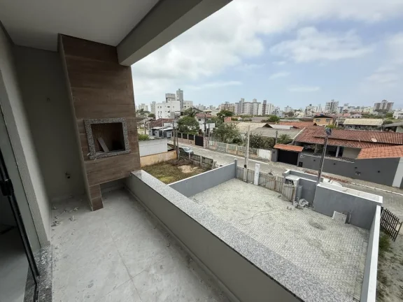 Imagem Apartamento de dois dormitórios, sendo uma suíte, sacada com churrasqueira e uma vaga de garagem no bairro de Gravatá, em Navegantes - Adriano Carpes imóveis vende