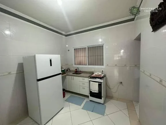 Imagem Sobrado com 3 dormitórios à venda, 125 m² por R$ 650.000 - Caiçara - Praia Grande/SP