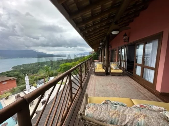 Imagem Deslumbre-se com esta incrível oportunidade de adquirir uma casa dos sonhos no exclusivo condomínio Yacamim, localizado em Ilhabela. Com uma vista esp