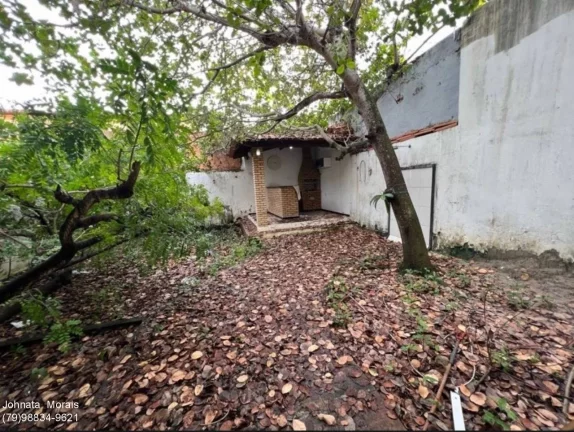 Imagem Casa à venda no Bairro Coroa do Meio com 6 quartos, área gourmet e jardim.