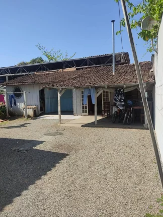 Imagem Terreno com uma casa mista no paranaguamirim