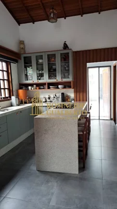 Imagem Casa Elegante com 4 Dormitórios a 700 metros da praia de Massaguaçu.