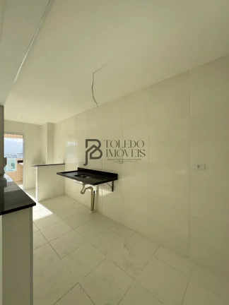 Imagem Apartamento de 2 dormitórios sendo 1 suíte, prédio frente mar no bairro Vila Mirim - Praia Grande