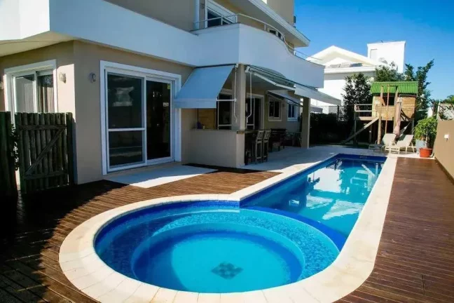 Imagem Casa com 5 dormitórios sendo 4 suítes e 6 vagas de garagem em Jurerê Internaciona l Florianópolis/SC