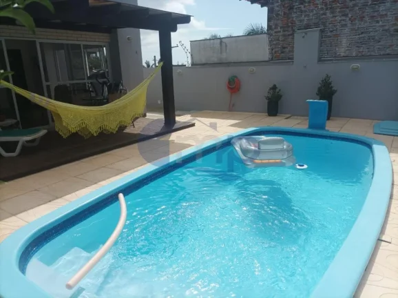 Imagem Casa de alto padrão á venda com 4 suites no bairro Centenário em Torres/RS