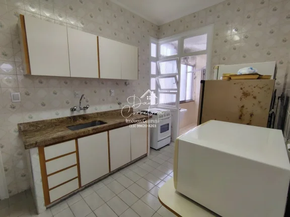 Imagem Imperdível! Apartamento de 3 quartos com suíte e 2 salas em Pitangueiras, Guarujá-SP. 100m² de conforto e elegância.