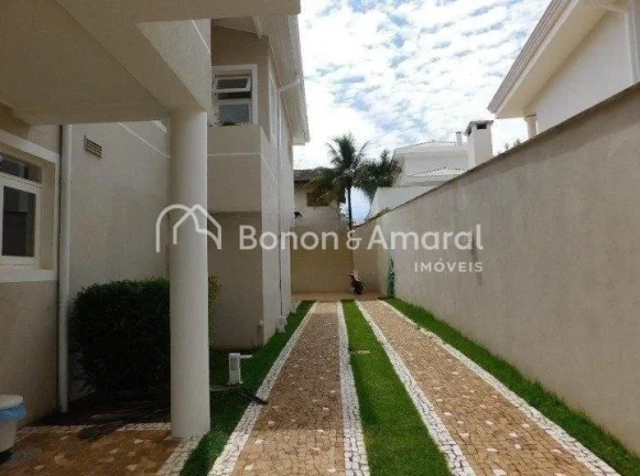 Imagem Casa em condomínio com 410 m² e 4 quartos