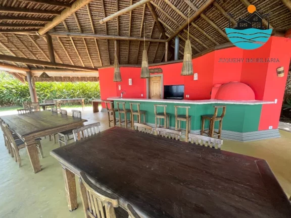 Imagem Alugar casa Juquehy - Casa em Condomínio 4 dormitórios, 3 suítes, 4 vagas, serviço e apoio de praia privativo - máx. 10 pessoas | Juquehy Imobiliária.