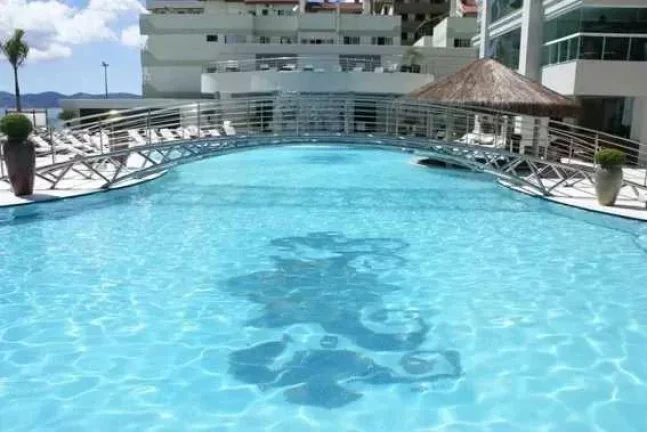Imagem Apartamento frente mar mobiliado com 4 suítes e 3 vagas de garagem em Itapema