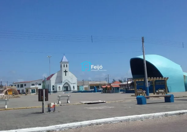 Imagem Casa 2 dormitórios com suíte, pátio frente e fundos e garagem coberta no Centro de Cidreira