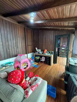 Imagem Casa com 3 dormitórios sendo 1 suíte e 2 vagas de garagem em Itapema/SC