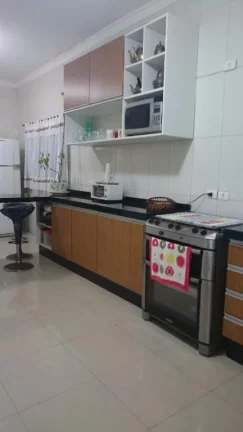 Imagem Sobrado à venda, 320 m² por R$ 1.200.000,00 - Maracanã - Praia Grande/SP