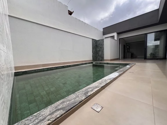 Imagem Casa Alto Padrão à Venda no Alto dos Caiçaras – 3 Suítes, Piscina e Área Gourmet em Patos de Minas