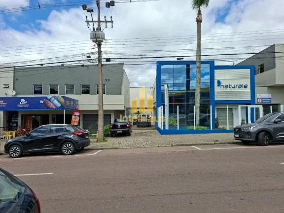 Imagem Imóvel comercial à venda em localização estratégica no Bacacheri, em terreno de esquina com gra...