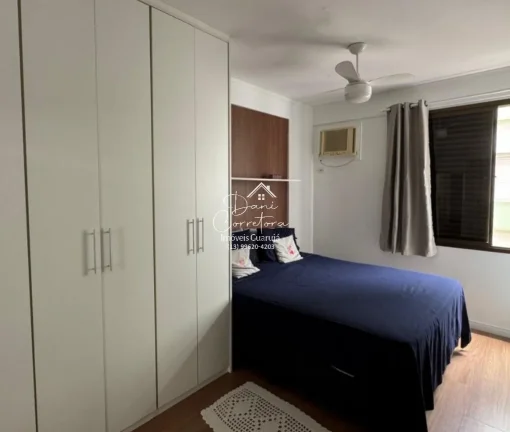 Imagem Aluguel de apartamento no Jardim Astúrias, Guarujá-SP: 2 quartos, 1 suíte, 2 salas, 2 banheiros, 1 vaga de garagem, 85m² de área.