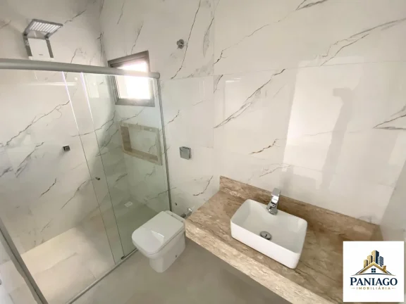 Imagem Casa de alto padrão com 3 suítes, cozinha gourmet e piscina com cascata