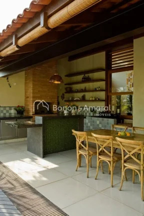 Imagem Casa com arquitetura diferenciada no condomínio Alphaville Campinas. A espaçosa residência possui...