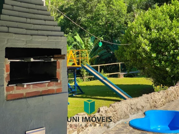 Imagem Chácara com 10 suítes e Cachoeira a venda, 9.104M² na zona rural de Guarapari.