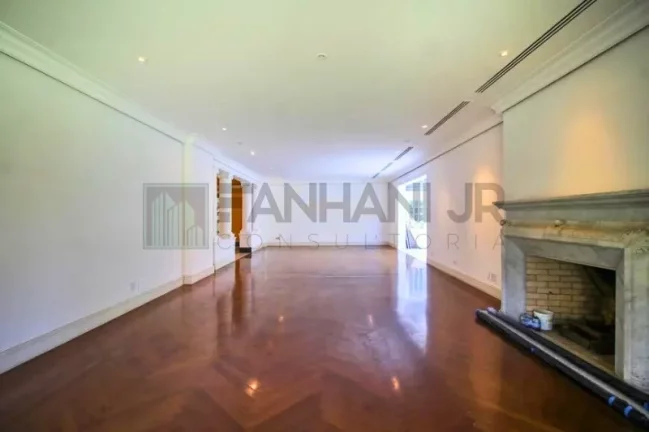 Imagem Luxuosa casa de alto padrão de 4 suítes no Jardim América: 6 salas, 8 banheiros, 12 vagas de garagem e 1.029m² de área em SP.