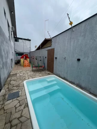 Imagem Sobrado com 4 dormitórios para alugar, 200 m² por R$ 4.180,00/mês - Travessão - Caraguatatuba/SP