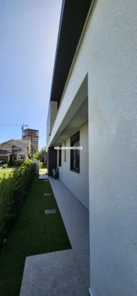 Imagem Casa Nova em condomínio fechado à venda com 5 suítes, 6 vagas de garagem localizada na Praia Brava .