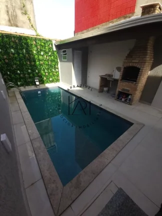 Imagem Casa para Venda em Praia Grande, Mirim, 2 dormitórios, 1 suíte, 3 banheiros, 3 vagas