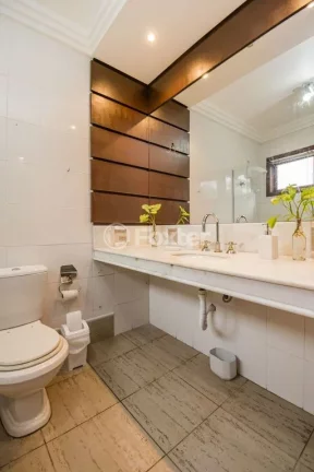 Imagem Casa em Condomínio 3 dorms à venda Avenida Vicente Monteggia, Cavalhada - Porto Alegre