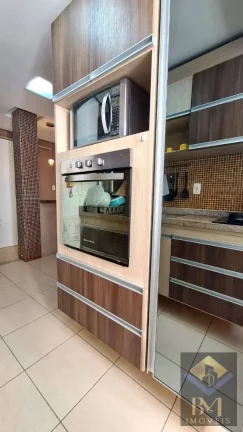 Imagem APARTAMENTO NO BOQUEIRÃO FRENTE MAR COM VARANDA E PORTEIRA F