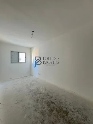 Imagem Apartamento de 2 dormitórios sendo 1 suíte, prédio frente mar no bairro Vila Mirim - Praia Grande