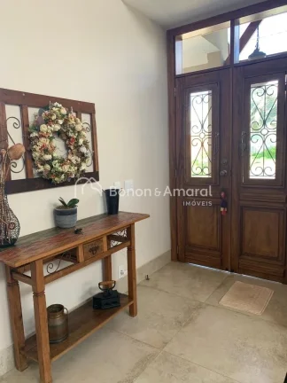 Imagem Casa térrea com sala de estar, sala de tv, lavabo, sala de jantar integrada à cozinha planejada e ...