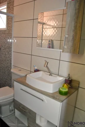 Imagem Casa de 3 Dormitórios sendo 2 Suítes, vaga para 2 carros com pátio.