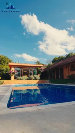 Imagem CASA TÉRREA ESTILO NORMANDO, 4 SUÍTES, TERRENO 1.107m², COND. NA GRANJA