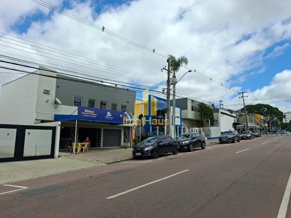 Imagem Imóvel comercial à venda em localização estratégica no Bacacheri, em terreno de esquina com gra...