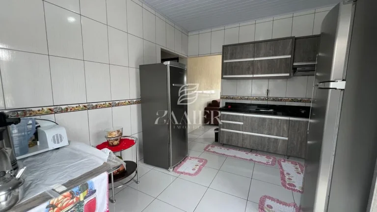 Imagem Terreno com Duas Casas Térreas – Oportunidade para Investir ou Morar Bem
